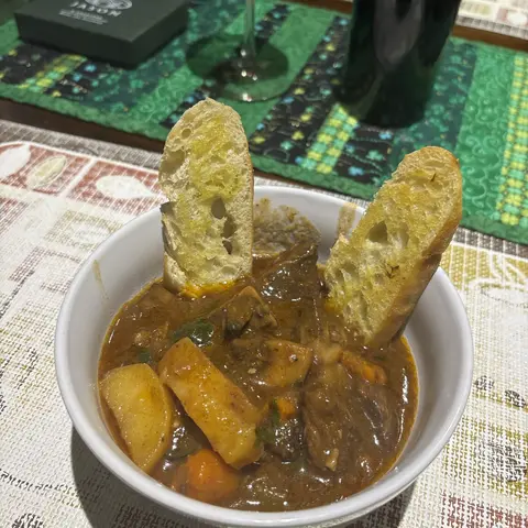 Beef stew served with crusty bread