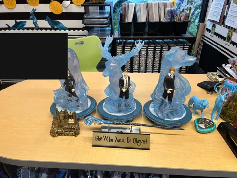 Teacher's table with Patronus figurines